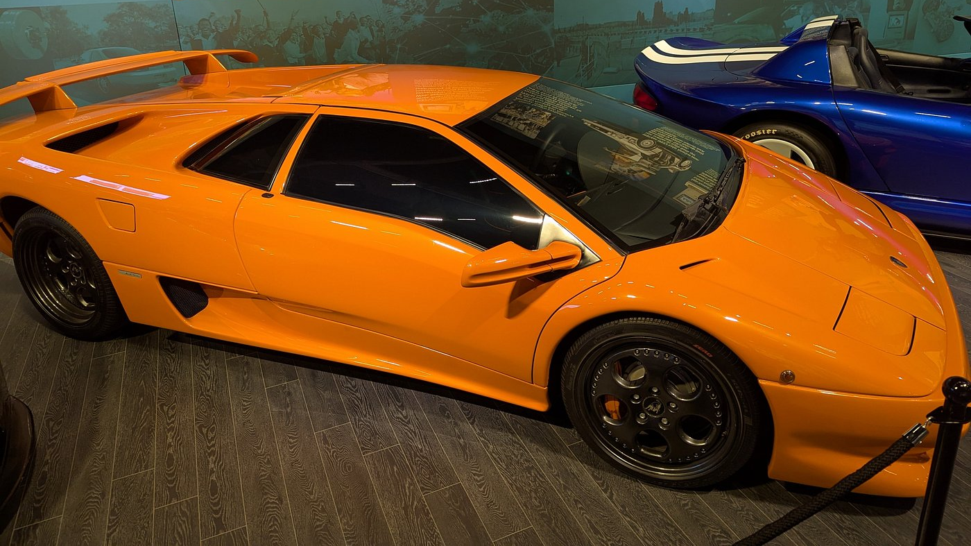 a yellow sports car parked in a room in Rahmi M. Koç Museum