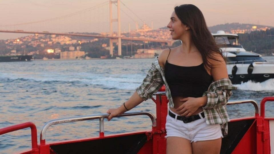 a woman standing on a boat in Golden Horn Boat Tour
