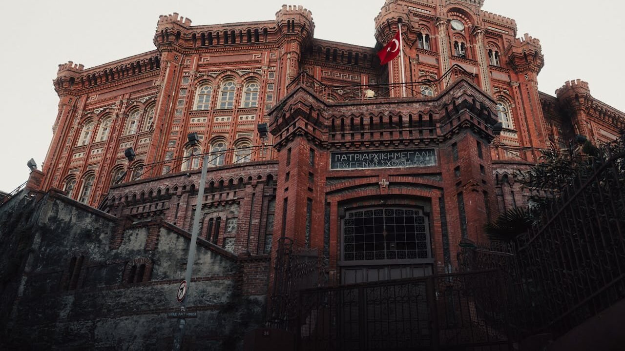 a building with a flag on top Greek Orthodox College at Sunset
