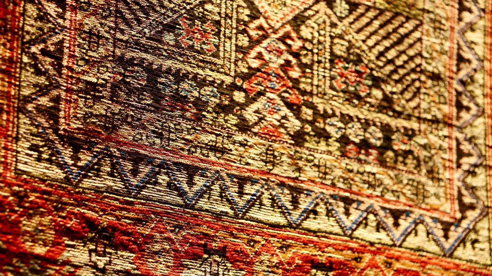 a close up of a rug with a pattern on it