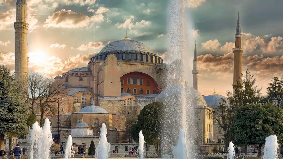 Istanbul's Must-Visit Historical Sites and Museums fountain in front of The Hagia Sophia building under cloudy sky during daytime