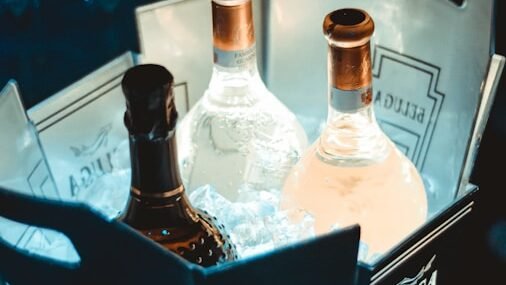 a couple of bottles of alcohol sitting inside of a box