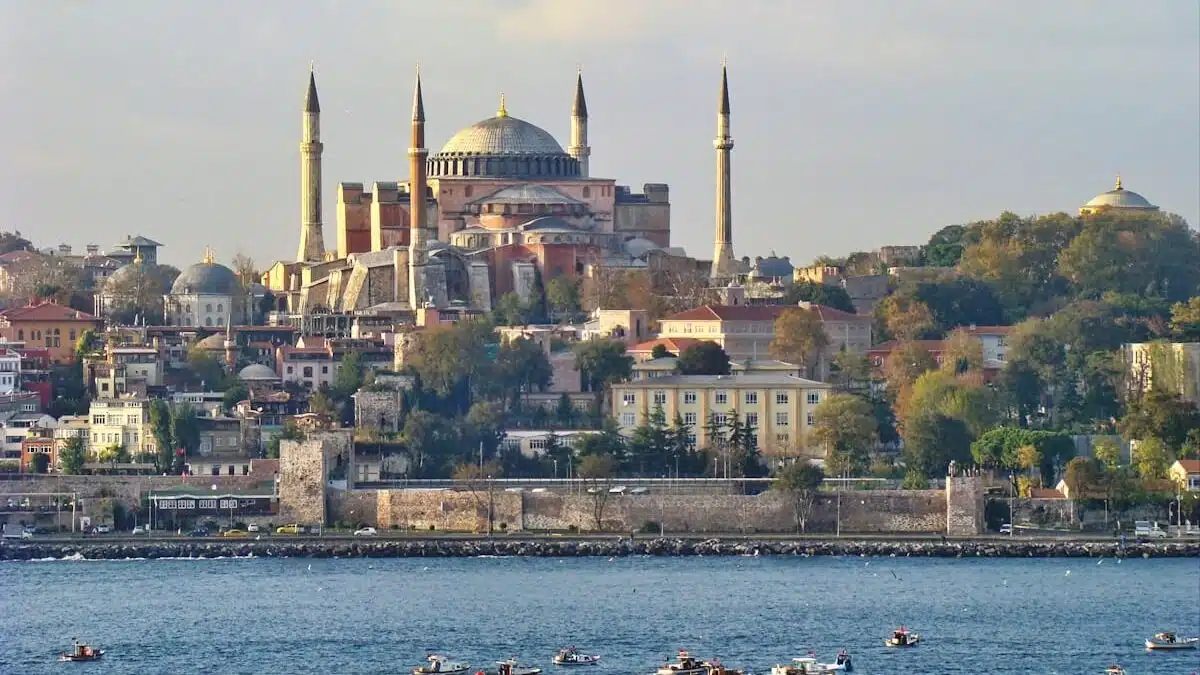 Hagia Sophia Timeline: From Church to Mosque to Museum to Mosque Again a view of a city from across the water