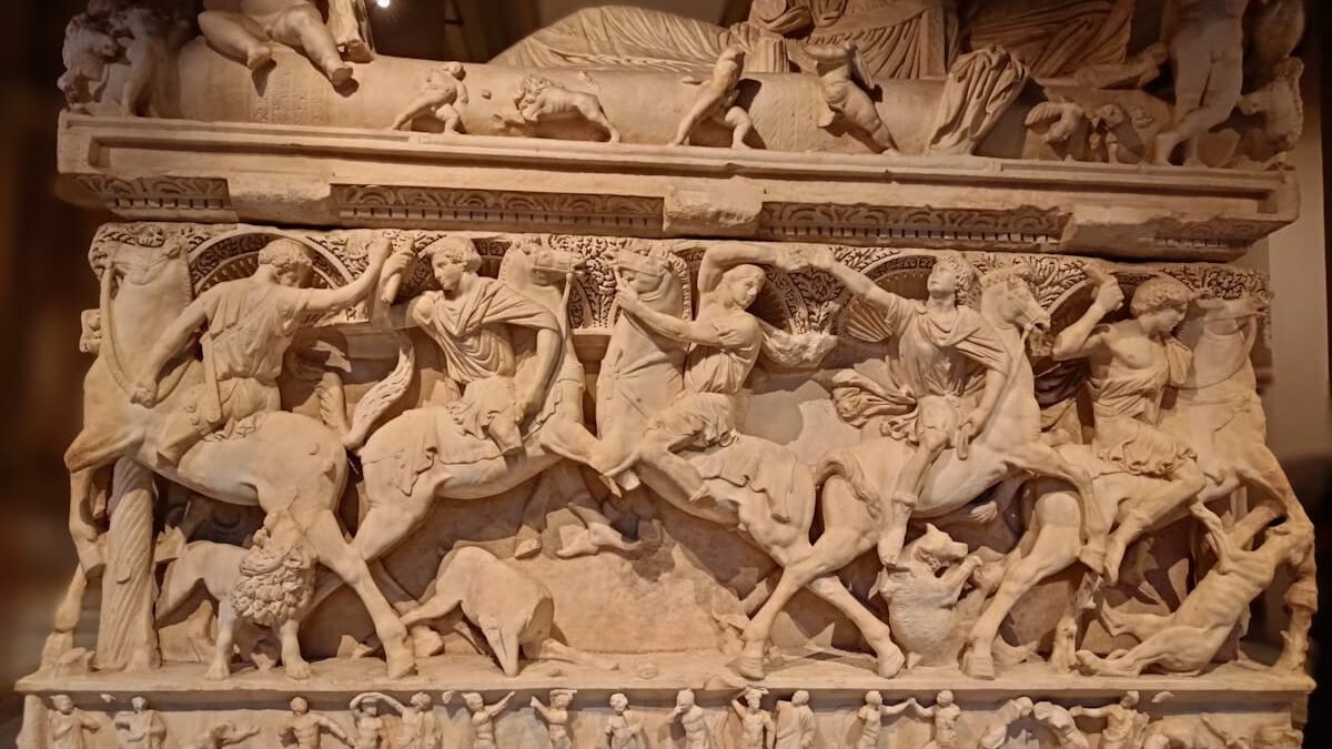 Istanbul Archeological Museums - a stone sculpture of a group of people riding horses