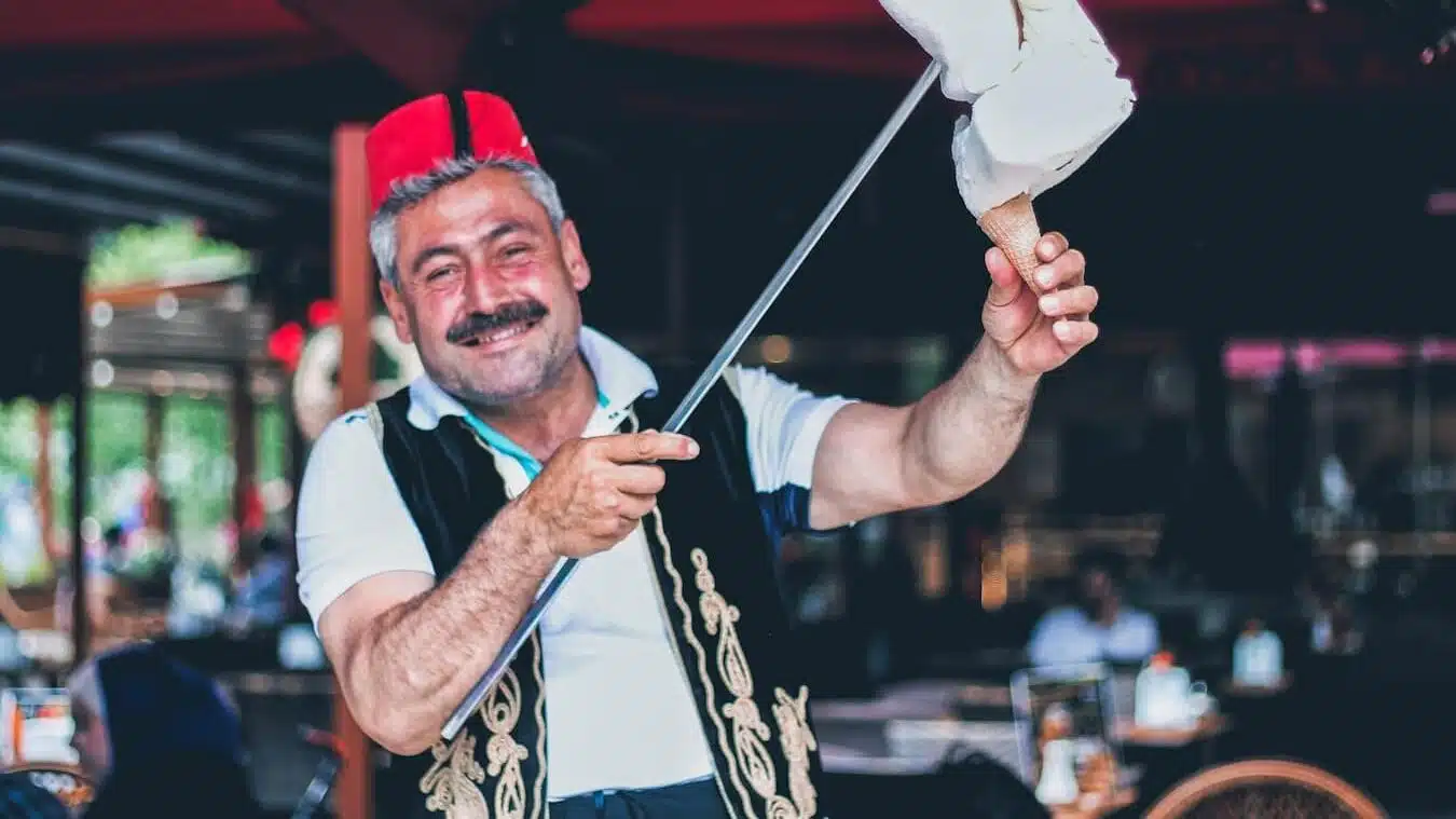 Best Cultural Experiences in Istanbul You Must Discover man smiling and holding stick with ice cream on cone