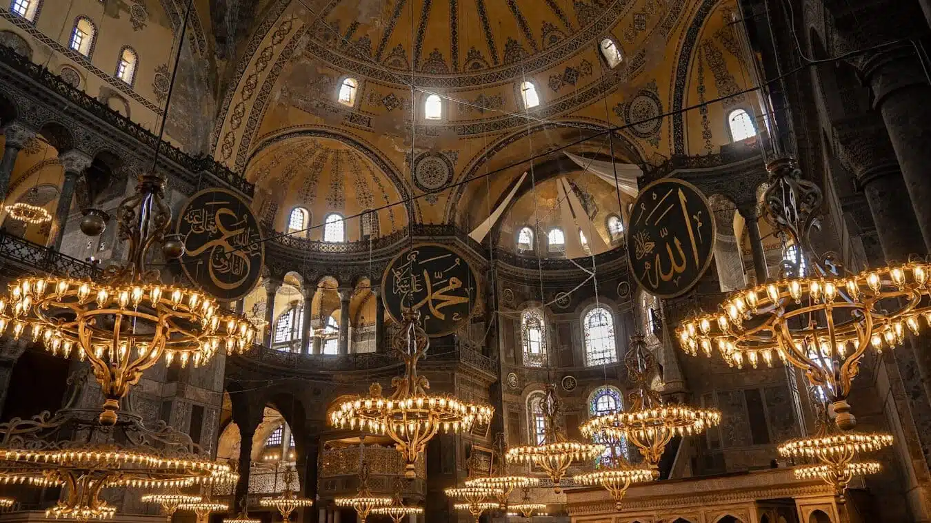 15 Things You Didn't Know About Hagia Sophia a chandelier hangs from the ceiling of a large building