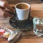 white ceramic cup near mug