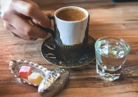 white ceramic cup near mug