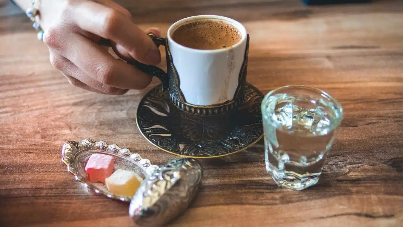 white ceramic cup near mug