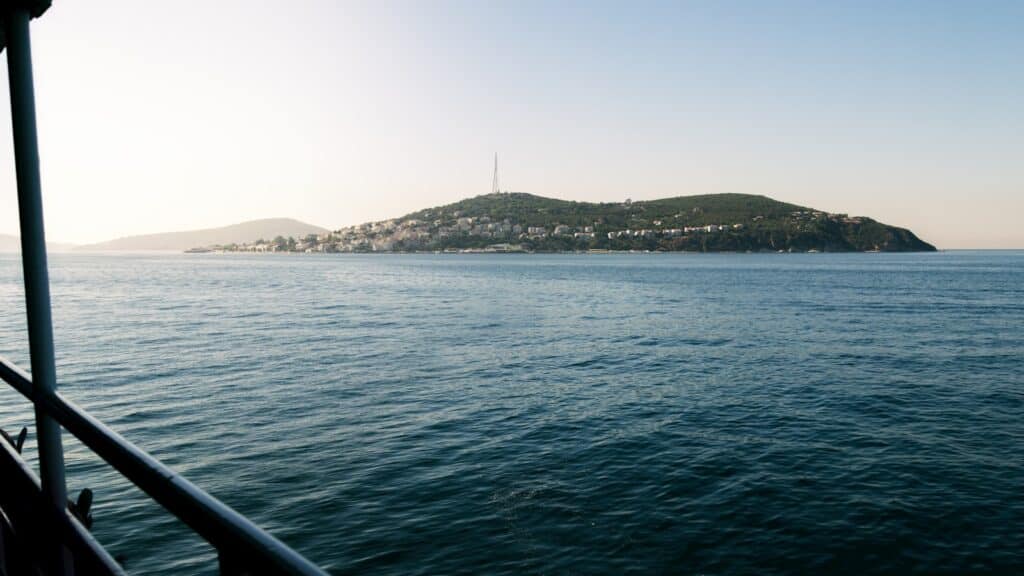 a body of water with a small island in the distance
