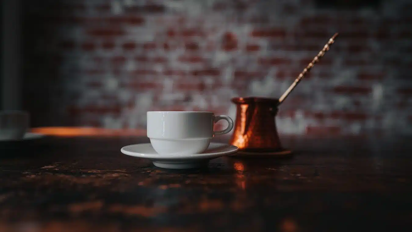 a Turkish Coffee cup and saucer on a table