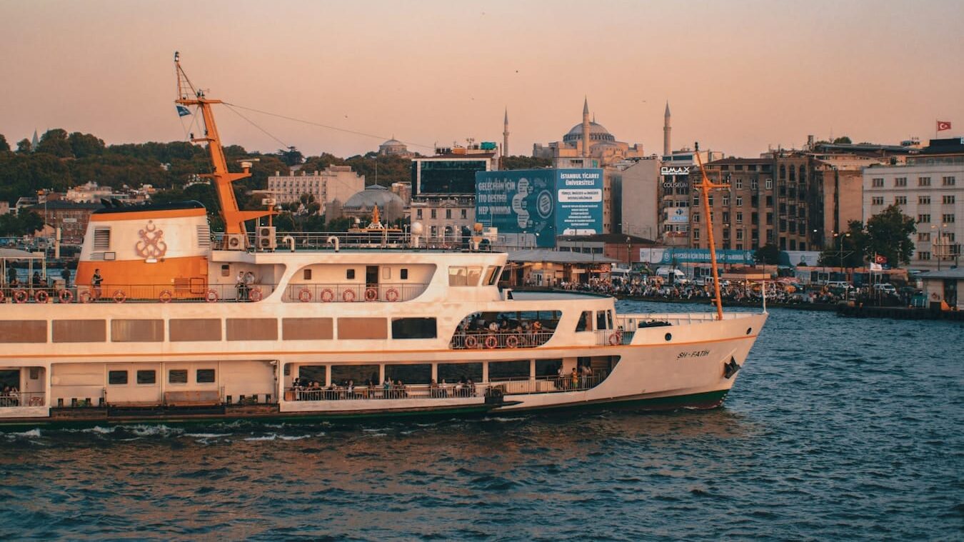 Eminönü - white and brown boat on sea during daytime