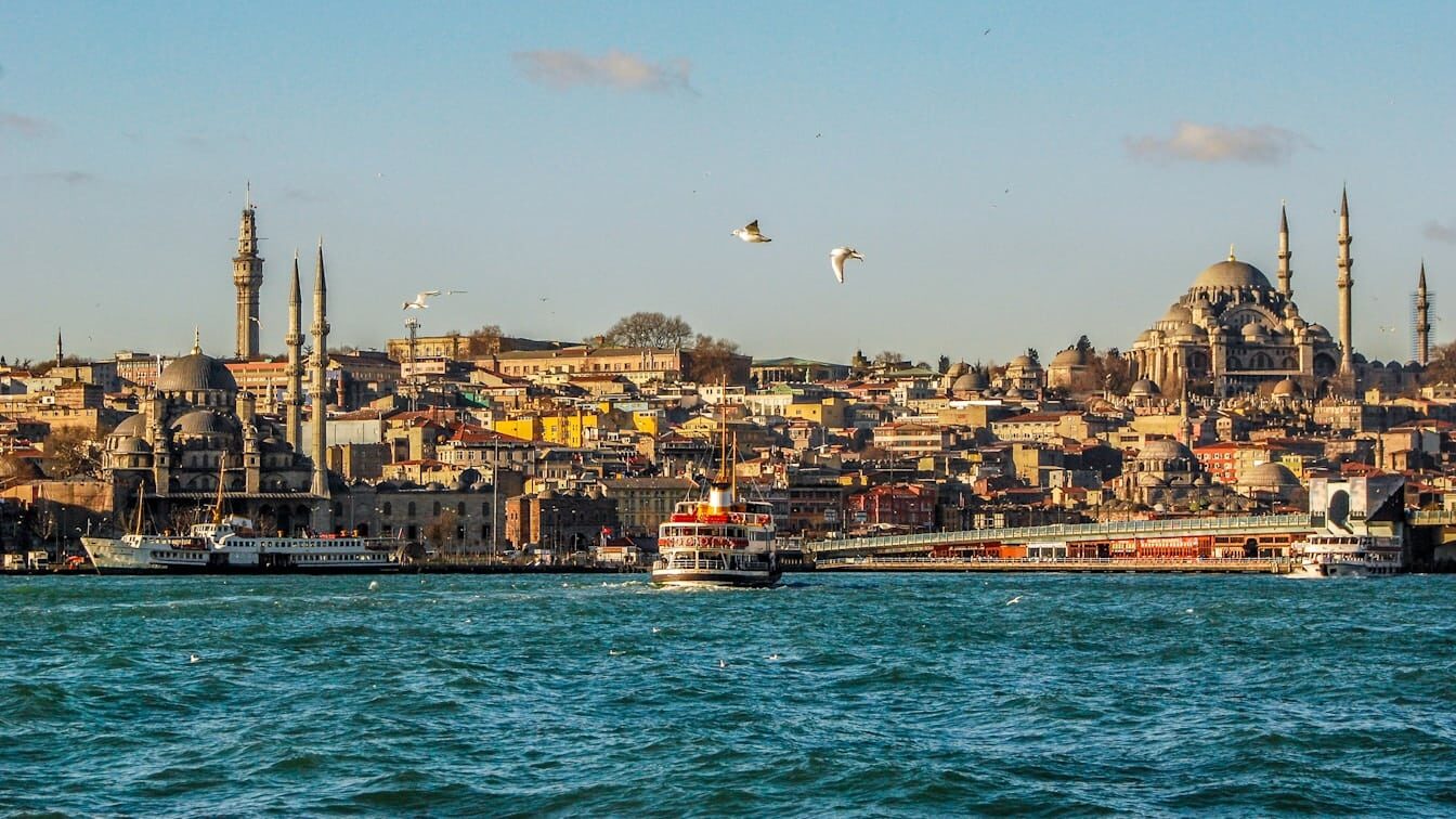 city buildings near body of water during daytime