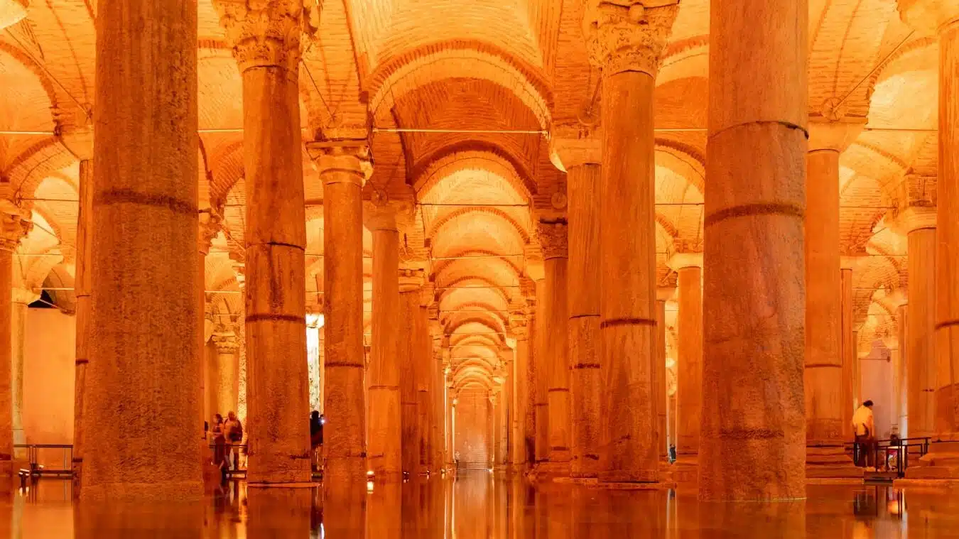 a group of people standing inside of a building
