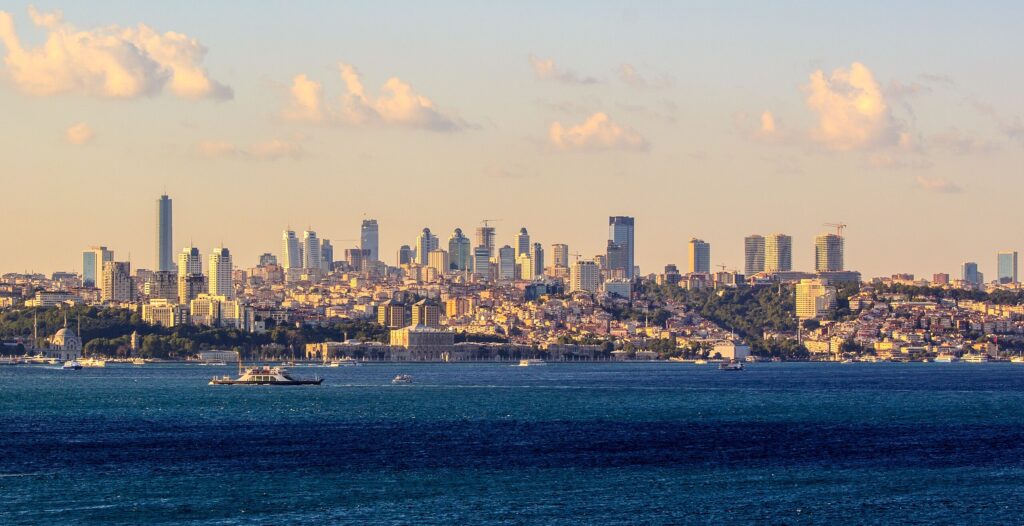 Modern Istanbul skyline at sunset showing high-rise buildings and warm light