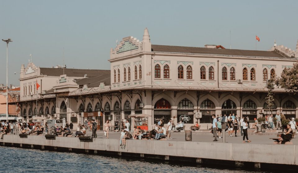 Exploring Kadıköy: A Vibrant District of Istanbul people walking on sidewalk near brown concrete building during daytime