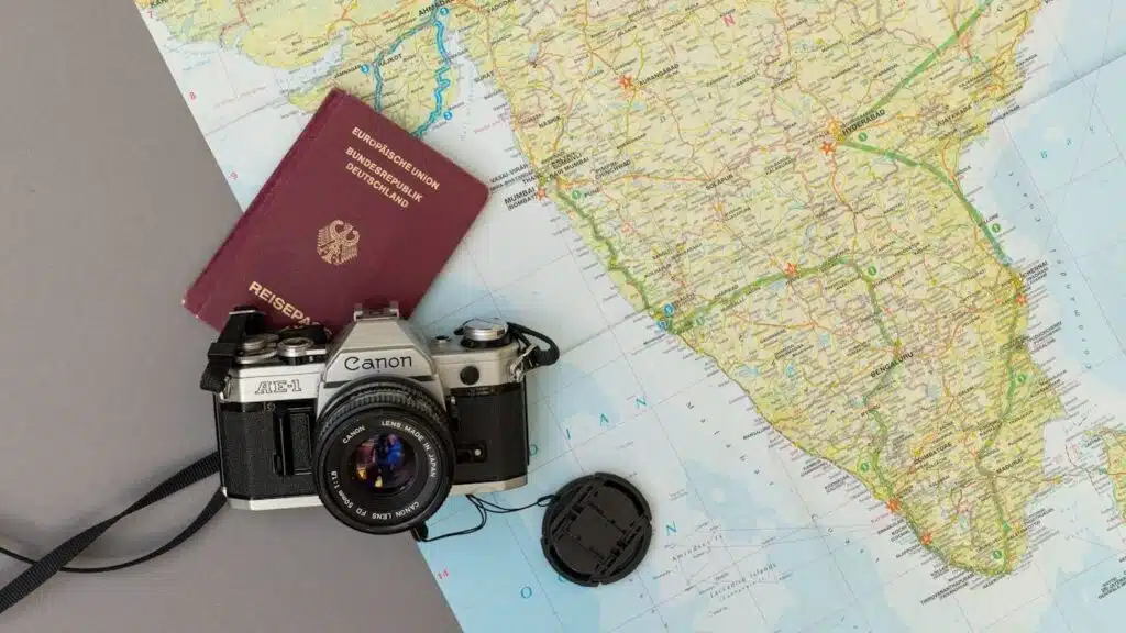 black and silver nikon dslr camera on red book